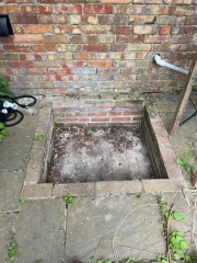Drainage(?) Pit in Patio Help