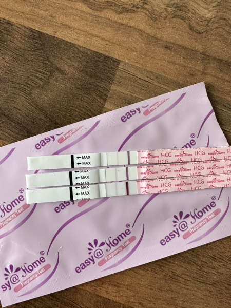 5 month old baby, a period and a + test?!?! HELP