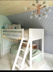 Parents sleeping in living room so child can have own room