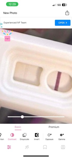 Help - brown discharge after one faint positive test