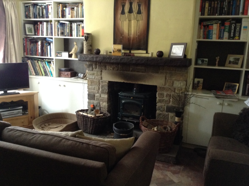 Cupboard in recess between chimney breast  and wall