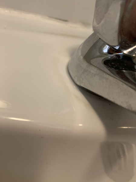 How to remove stains round taps?