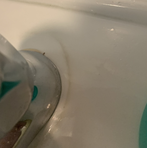 How to remove stains round taps?