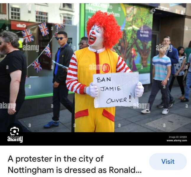 There is a man dressed up as Ronald McDonald walking round my city.