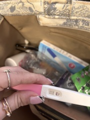 Help - brown discharge after one faint positive test