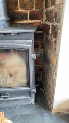 What to do with these ugly bricks in fireplace?