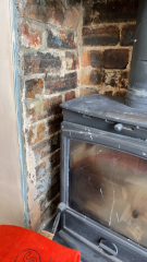 What to do with these ugly bricks in fireplace?