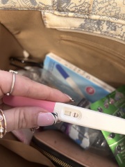 Help - brown discharge after one faint positive test