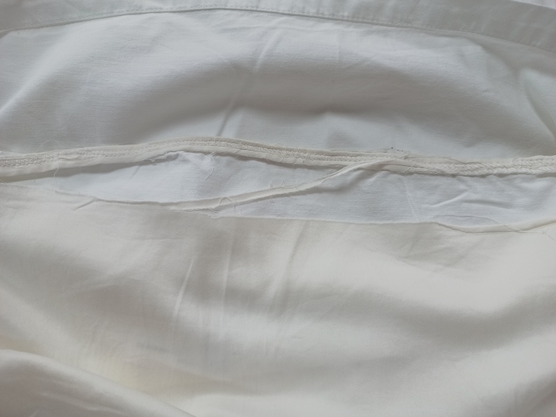 Stitching up a split silk pillowcase. Again.