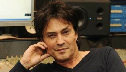 AIBU for having a crush on this elderly Croatian singer? Do you find him attractive?
