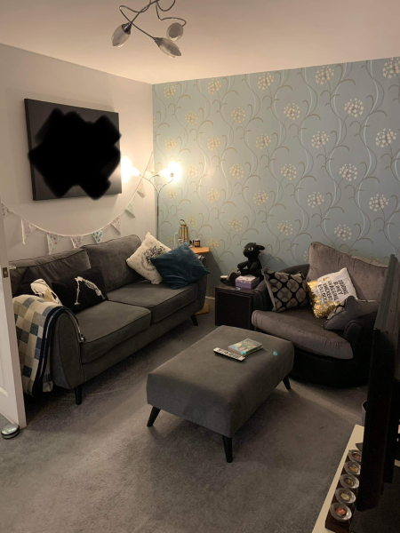 What can I do with grey sofa and carpet to make the room look warmer/cosier?