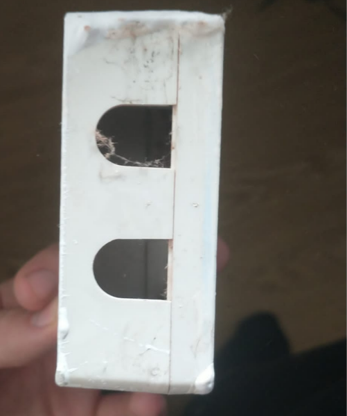 What is this white box which fell off wall, exposing a cable?