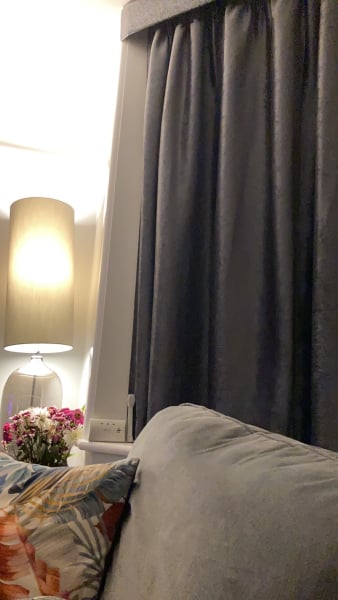What can I do with grey sofa and carpet to make the room look warmer/cosier?