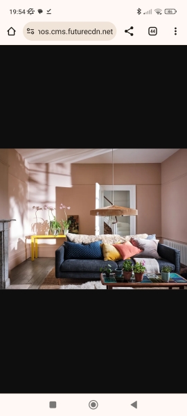 What can I do with grey sofa and carpet to make the room look warmer/cosier?