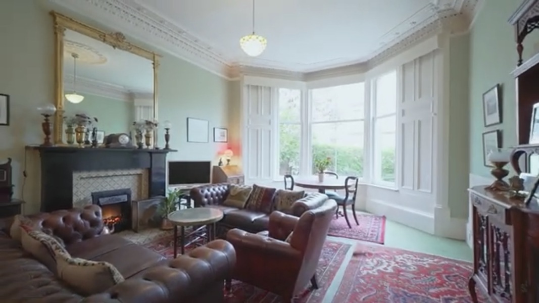 Warming up a pale green living room for Winter