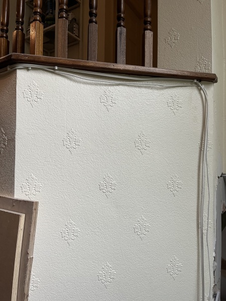 What to do about this ‘feature’ after wall removal?