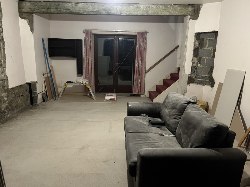 What to do about this ‘feature’ after wall removal?