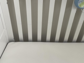 Cot mattress has stained cot - reply from customer services