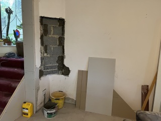 What to do about this ‘feature’ after wall removal?