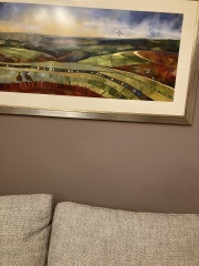What can I do with grey sofa and carpet to make the room look warmer/cosier?