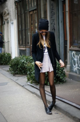 Standing pigeon-toed, looking at the ground while lightly touching your hair...