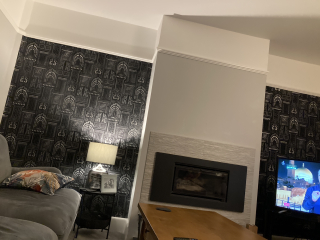 What can I do with grey sofa and carpet to make the room look warmer/cosier?