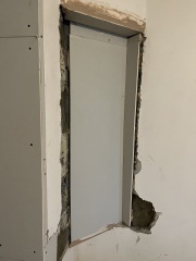 What to do about this ‘feature’ after wall removal?