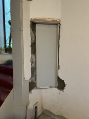 What to do about this ‘feature’ after wall removal?