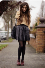 Standing pigeon-toed, looking at the ground while lightly touching your hair...