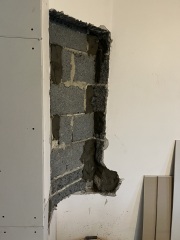 What to do about this ‘feature’ after wall removal?