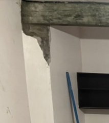 What to do about this ‘feature’ after wall removal?