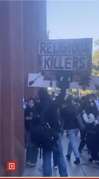 Placards from antisemitic marches in London