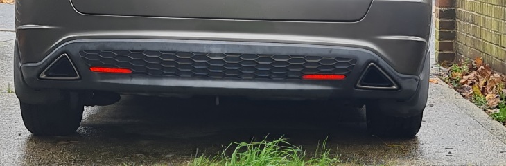 Anyone with basic car knowledge - car stands higher on one and some sort of spring is hanging lower on other side
