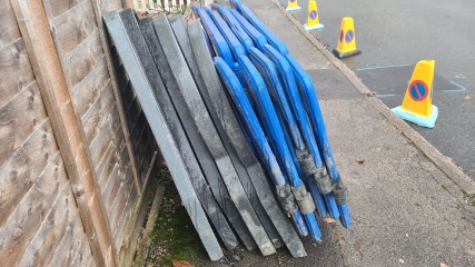 Contractors stuff balanced against my fence! Should I move it? AIBU?