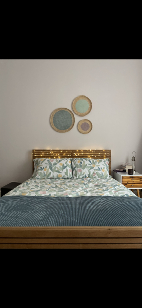 Three pictures over a bed