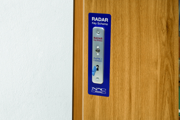 Banging on the door of the Accessible Toilet