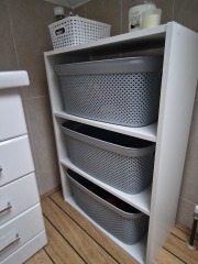 Wooden units that hold laundry baskets