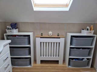 Wooden units that hold laundry baskets