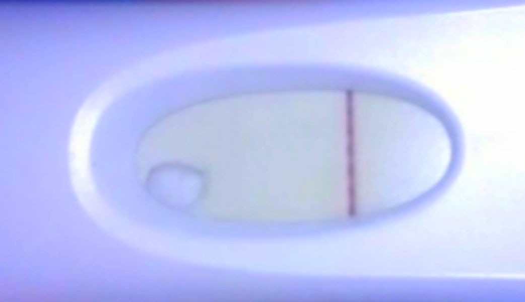 Faint positive or evaporation line?