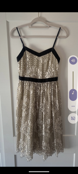 Cream lace mini dress, at a wedding…