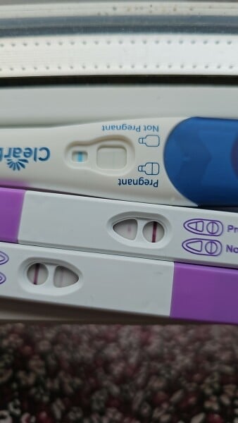 Help - 2 weeks late on period, 3 postive tests after time window, negative test in evenings?!