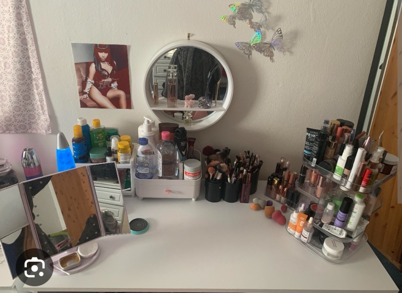 Small wall mounted cupboard for make up.