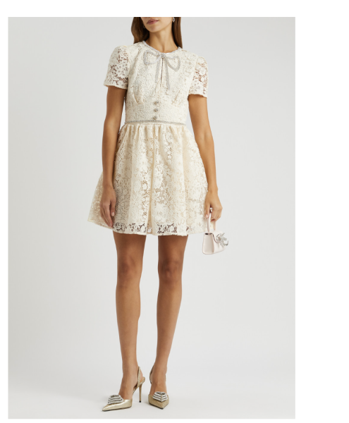 Cream lace mini dress, at a wedding…
