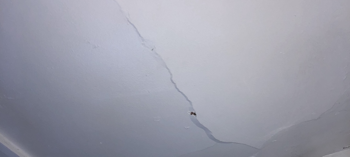Buldging crack in ceiling with hole (rental) advice