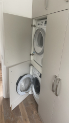 Should I put my washing machine and dryer in the cupboard under the stairs?