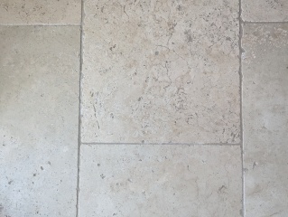 How do I clean my travertine stone floor?