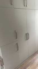 Should I put my washing machine and dryer in the cupboard under the stairs?