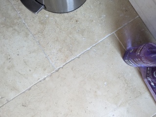 How do I clean my travertine stone floor?