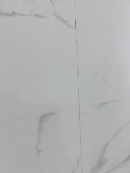 Bathroom: sealant over grouting?