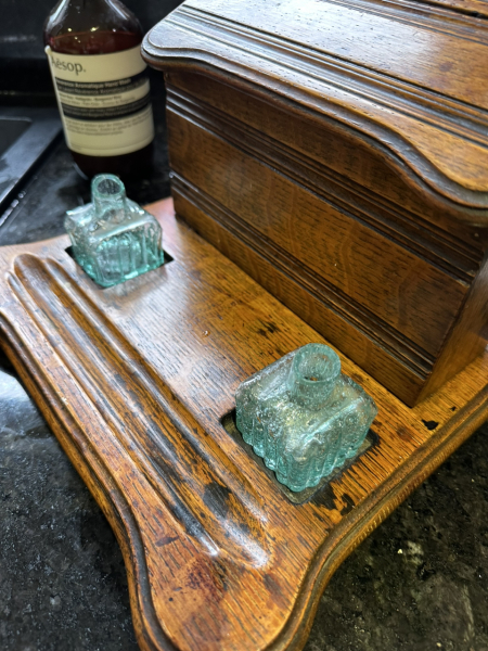 How old would you say this writing / letter rack is?